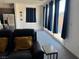 Comfortable living room with plush carpeting and sliding glass doors at 411 Hellebores Ave, North Las Vegas, NV 89084