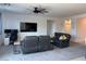 Comfortable living room provides ample seating, a large TV, and space to work at 411 Hellebores Ave, North Las Vegas, NV 89084