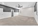 Expansive bedroom featuring two-tone walls, ceiling fan, and ample natural light at 4510 Rubious Ave, North Las Vegas, NV 89084