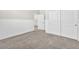 Bright bedroom featuring gray carpet, white trim and an accessible closet at 4510 Rubious Ave, North Las Vegas, NV 89084
