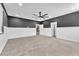 Spacious bedroom with neutral carpet and a modern ceiling fan at 4510 Rubious Ave, North Las Vegas, NV 89084