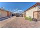 Paver driveway with a private gate offering extra parking and security, enhancing the home's curb appeal at 4510 Rubious Ave, North Las Vegas, NV 89084