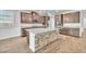 Modern kitchen with stainless steel appliances, granite countertops, and an island offering additional seating at 4510 Rubious Ave, North Las Vegas, NV 89084
