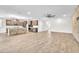 Open kitchen featuring a large island with stone accents, stainless steel appliances, and ample cabinet space at 4510 Rubious Ave, North Las Vegas, NV 89084
