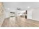 Bright living room with a ceiling fan and sliding glass doors leading to the backyard at 4510 Rubious Ave, North Las Vegas, NV 89084