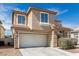 Charming two-story home boasts a two-car garage and a beautifully landscaped front yard at 4622 English Lavender Ave, North Las Vegas, NV 89031