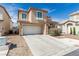 Two-story home features a well-maintained lawn, driveway, and a two-car garage at 4622 English Lavender Ave, North Las Vegas, NV 89031