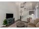 Comfortable living room featuring a staircase, with modern decor at 4622 English Lavender Ave, North Las Vegas, NV 89031