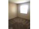 Well-lit bedroom with neutral walls and carpet flooring at 5220 Mission Carmel Ln # 207, Las Vegas, NV 89107