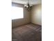 Dining room with carpet flooring and a chandelier at 5220 Mission Carmel Ln # 207, Las Vegas, NV 89107