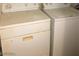 Close-up of a stacked washer and dryer set in a laundry area at 5220 Mission Carmel Ln # 207, Las Vegas, NV 89107