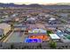 An aerial view displays a backyard featuring a sparkling pool and manicured landscaping at 5328 Hickory Tree St, Las Vegas, NV 89149