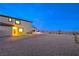 View of side of stucco home with manicured gravel, small turf area, and mountain views at 5328 Hickory Tree St, Las Vegas, NV 89149