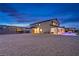 Large stucco home with in-ground pool, covered patio, gravel backyard, and mountain views at 5328 Hickory Tree St, Las Vegas, NV 89149