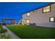 Large backyard features turf, pergola covered seating, and stucco home exterior at 5328 Hickory Tree St, Las Vegas, NV 89149