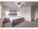 Cozy bedroom with a decorative ceiling fan and plush carpet at 5328 Hickory Tree St, Las Vegas, NV 89149