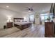 Serene bedroom with a king bed, natural light, and modern furnishings at 5328 Hickory Tree St, Las Vegas, NV 89149