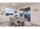 Cozy dining area featuring a table with seating for six and sliding glass doors to the outdoor patio at 5328 Hickory Tree St, Las Vegas, NV 89149