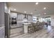 Modern kitchen features sleek gray cabinets, granite countertops, and stainless steel appliances at 5328 Hickory Tree St, Las Vegas, NV 89149
