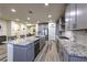 This spacious kitchen boasts granite countertops, stainless steel appliances, and an open layout at 5328 Hickory Tree St, Las Vegas, NV 89149