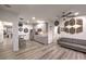 Open-concept living room features a modern kitchenette, sleek floors, and stylish decor at 5328 Hickory Tree St, Las Vegas, NV 89149