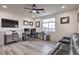 Home office features a large desk, comfortable seating, and natural light at 5328 Hickory Tree St, Las Vegas, NV 89149