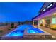 Backyard oasis featuring a sparkling pool and relaxing spa at twilight at 5328 Hickory Tree St, Las Vegas, NV 89149