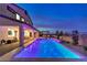 Backyard with luxurious pool, spa, covered patio, and stunning mountain views at 5328 Hickory Tree St, Las Vegas, NV 89149