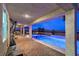Beautiful blue in-ground pool and brick-paved patio with covered seating and view at 5328 Hickory Tree St, Las Vegas, NV 89149
