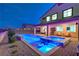 Outdoor pool and spa, surrounded by desert landscaping and a covered patio at 5328 Hickory Tree St, Las Vegas, NV 89149