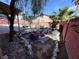 Backyard featuring tropical landscaping with a small bridge and rock features at 5600 Grossmont Ave, Las Vegas, NV 89110