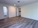 Neutral bedroom featuring modern wood floors and an attached bath at 5600 Grossmont Ave, Las Vegas, NV 89110
