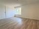 Bedroom with wood flooring and a window providing natural light at 5600 Grossmont Ave, Las Vegas, NV 89110