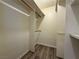 Walk-in closet with wood floors and shelving for organization at 5600 Grossmont Ave, Las Vegas, NV 89110