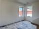 Open dining area with two windows and tile flooring, next to the kitchen at 5600 Grossmont Ave, Las Vegas, NV 89110