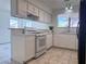 Renovated kitchen featuring white cabinets, quartz countertops and stainless steel appliances at 5600 Grossmont Ave, Las Vegas, NV 89110