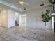 A spacious, light-filled living room featuring tile floors, neutral walls and a fireplace at 5600 Grossmont Ave, Las Vegas, NV 89110