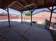 Covered patio with concrete floors overlooks the pool area in the backyard at 5600 Grossmont Ave, Las Vegas, NV 89110