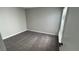 Bedroom with new carpet and neutral color scheme, features a large window at 5720 Goldmount Ave, Las Vegas, NV 89107