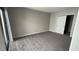 Bedroom featuring carpeted floors, neutral walls, and sliding closet doors at 5720 Goldmount Ave, Las Vegas, NV 89107
