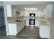 Modern kitchen featuring white cabinets, stainless steel appliances, and sleek countertops at 5720 Goldmount Ave, Las Vegas, NV 89107