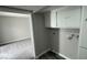 Small utility room with cabinets for storage, laundry hook ups at 5720 Goldmount Ave, Las Vegas, NV 89107