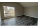 Bright living room with vaulted ceiling and new hardwood floors, plus a large window at 5720 Goldmount Ave, Las Vegas, NV 89107
