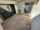 View of the outdoor patio with a sliding glass door and an exterior window at 5720 Goldmount Ave, Las Vegas, NV 89107