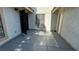 Spacious concrete patio area with a metal gate, offering a private outdoor space at 5720 Goldmount Ave, Las Vegas, NV 89107