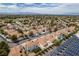 Wide aerial shot of the community displaying solar panels, lush greenery, and the Las Vegas skyline at 6 Sandwedge Dr, Henderson, NV 89074