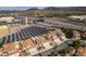 Aerial view of a suburban neighborhood showcasing solar panels, roadways, and community layout at 6 Sandwedge Dr, Henderson, NV 89074