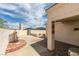 Desert landscaped backyard featuring brick and concrete patios at 6 Sandwedge Dr, Henderson, NV 89074