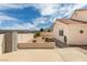 Backyard patio with desert landscaping, showcasing durable exterior storage and ample space at 6 Sandwedge Dr, Henderson, NV 89074