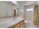 Cozy bathroom with a single sink vanity, a standard tub with shower, and a white toilet at 6 Sandwedge Dr, Henderson, NV 89074